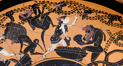 Detail view of a Attic black-figure kylix, ca. 510 BCE, depicting satyrs and maenads gathering grapes into baskets. Source: Wikimedia Commons